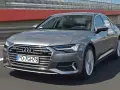 Szary Audi A6 na drodze. Sprawdź aktualną audi a6 cena i wyposażenie.
