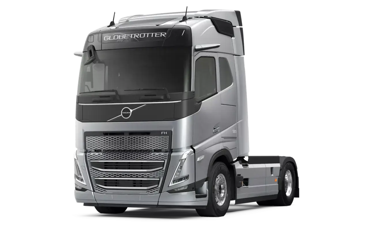 Srebrny ciągnik siodłowy Volvo FH13 Globetrotter z napisem "500" na błotniku, gotowy do dalekich podróży.