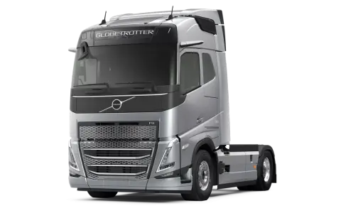 Srebrny ciągnik siodłowy Volvo FH13 Globetrotter z napisem "500" na błotniku, gotowy do dalekich podróży.