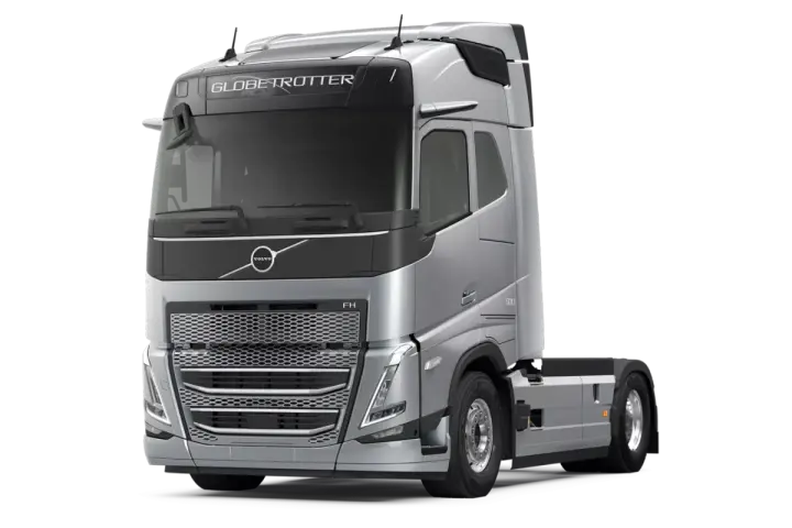Srebrny ciągnik siodłowy Volvo FH13 Globetrotter z napisem "500" na błotniku, gotowy do dalekich podróży.