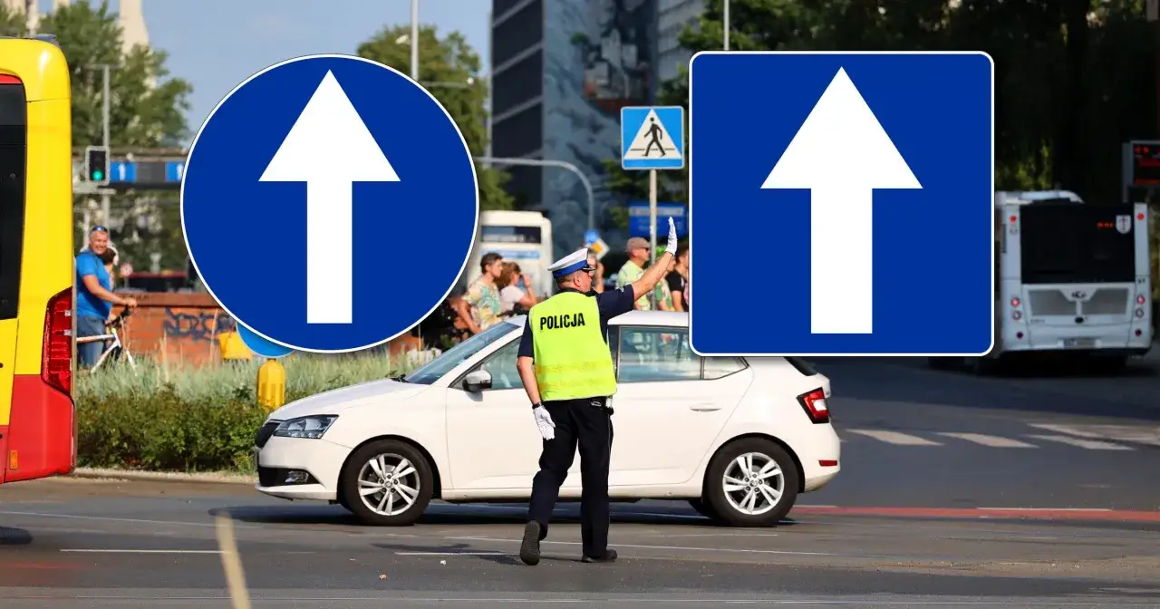 Policjant kieruje ruchem na drodze jednokierunkowej. Znaki informują o nakazie jazdy prosto.